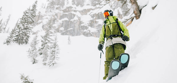 Skier wearing Kastle skis navigating fresh powder at Jackson Hole Mountain Resort, near Nomad Sports in Teton Village, Wyoming, showcasing the ultimate on-mountain experience.